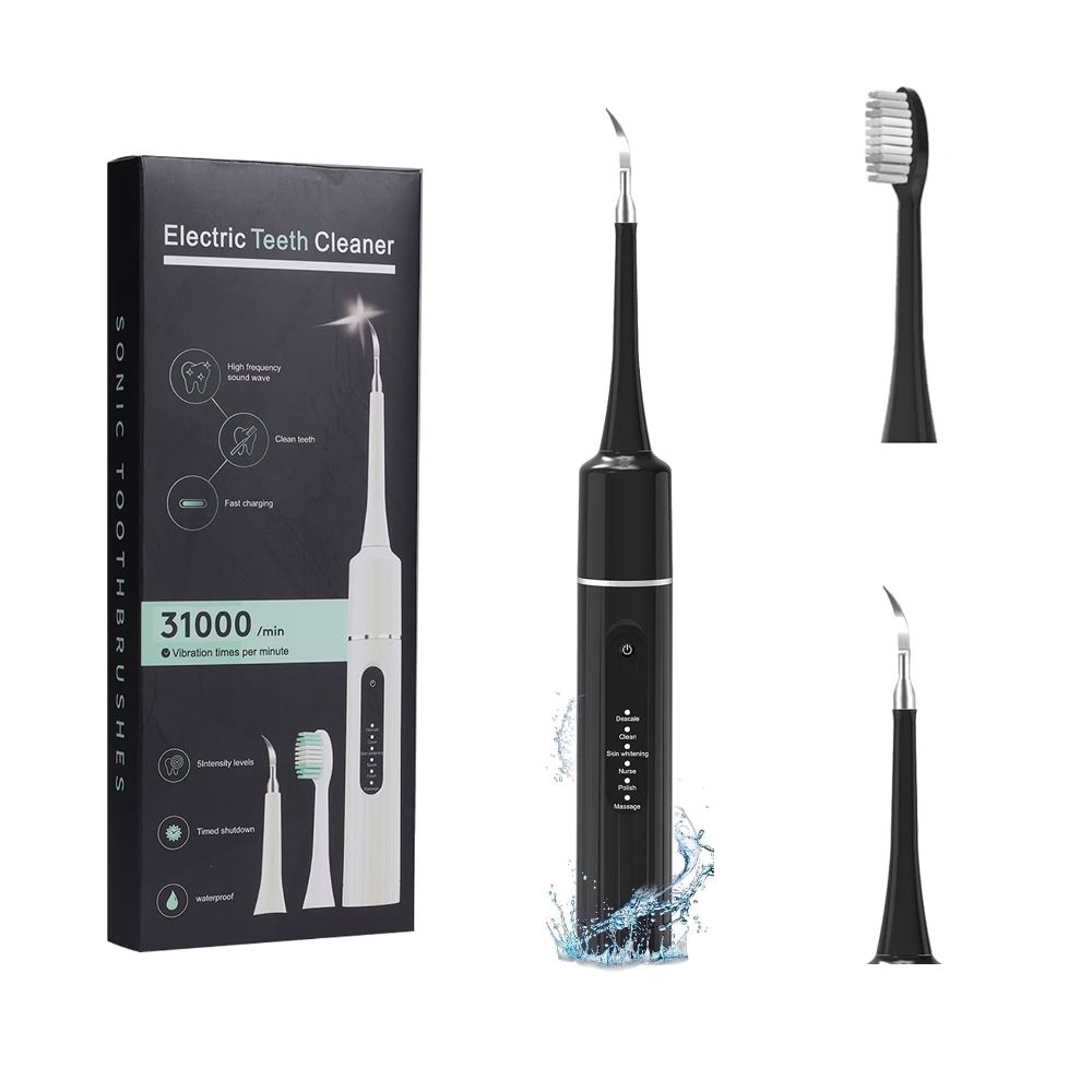 Ultrasonic Dental Cleaner with interchangeable cleaning tips and USB charging cable for plaque and tartar removal.